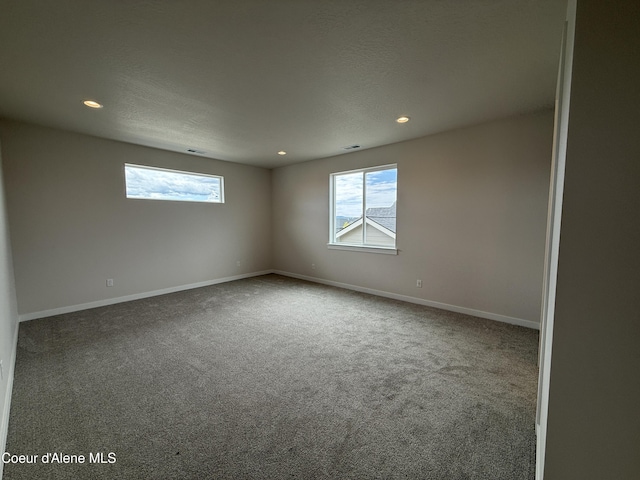 3402 N Cyprus Fox Loop, Post Falls, ID 83854 - carpeted empty room featuring plenty of natural light and recessed lighting