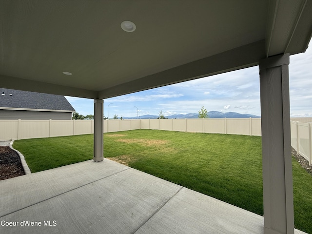 3402 N Cyprus Fox Loop, Post Falls, ID 83854 - fenced backyard featuring a patio area and a mountain view