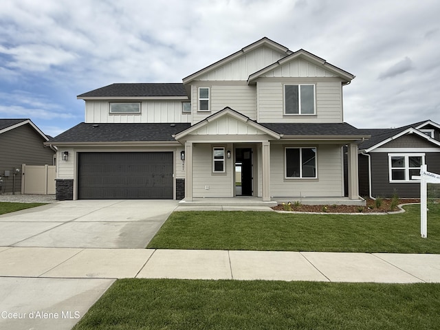 3402 N Cyprus Fox Loop, Post Falls, ID 83854 - craftsman house featuring board and batten siding, concrete driveway, a porch, and an attached garage