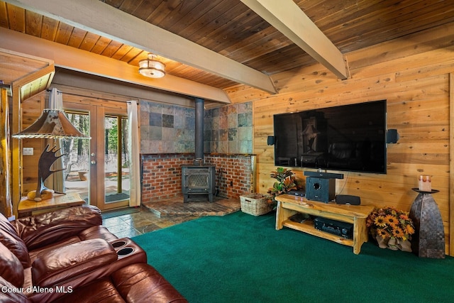 living area featuring french doors, wood walls, wooden ceiling, and beamed ceiling