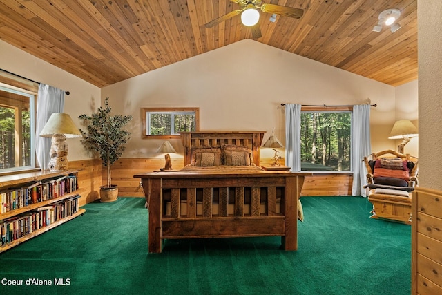 carpeted bedroom featuring wooden ceiling, wooden walls, ceiling fan, and lofted ceiling