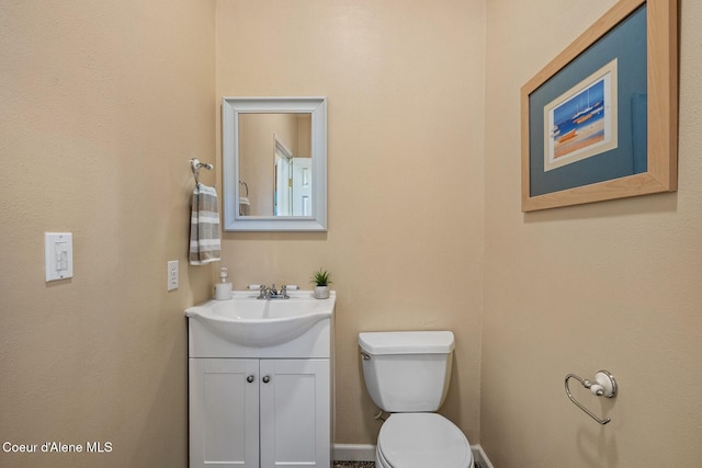bathroom with toilet and vanity