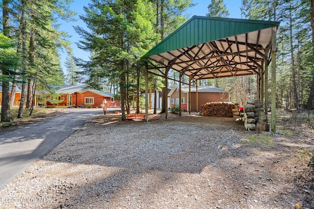 exterior space featuring a detached carport and driveway