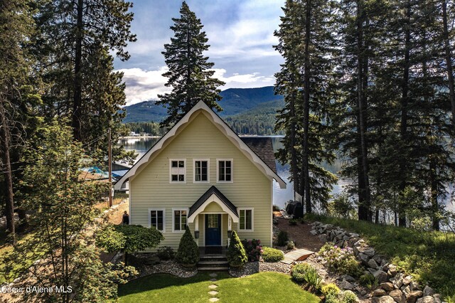 307 Quinns Ln, Cocolalla, ID 83813 - view of front facade featuring a mountain view and a front lawn