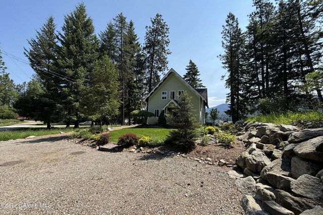 307 Quinns Ln, Cocolalla, ID 83813 - view of property exterior featuring a lawn
