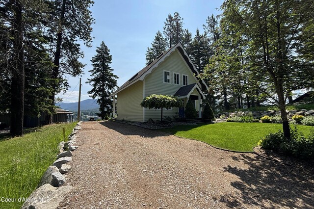 307 Quinns Ln, Cocolalla, ID 83813 - view of side of property featuring a yard and driveway