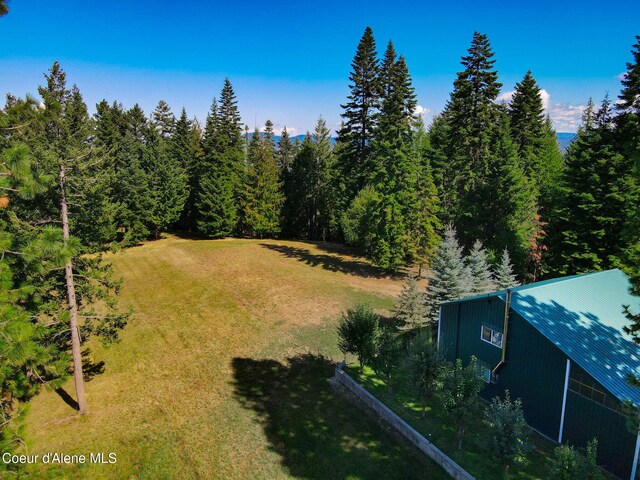 5758 E Burma Rd, Harrison, ID 83833 - birds eye view of property with a wooded view