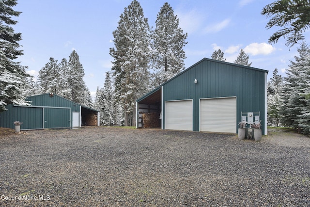 5758 E Burma Rd, Harrison, ID 83833 - garage featuring gravel driveway and a detached garage