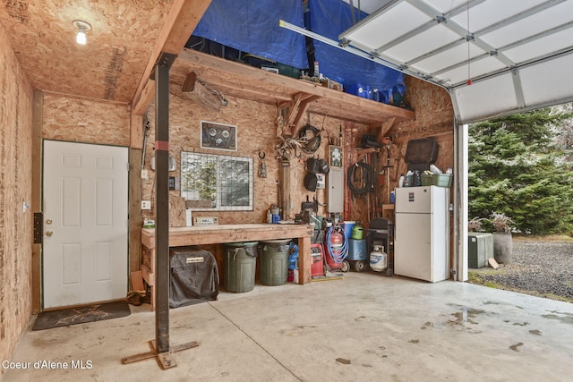 5758 E Burma Rd, Harrison, ID 83833 - garage featuring freestanding refrigerator