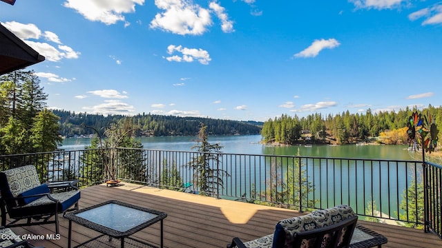 7431 E Cumberland Ct, Hayden, ID 83835 - deck with a wooded view and a water view