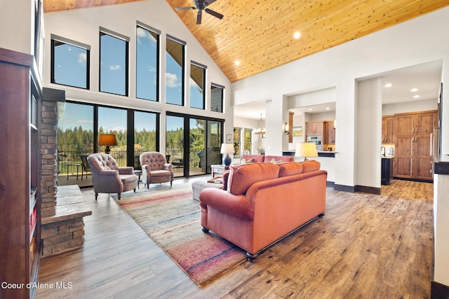 7431 E Cumberland Ct, Hayden, ID 83835 - living area with high vaulted ceiling, a ceiling fan, plenty of natural light, and hardwood / wood-style floors