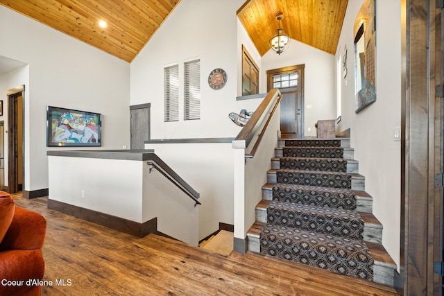 7431 E Cumberland Ct, Hayden, ID 83835 - stairs with high vaulted ceiling, recessed lighting, wooden ceiling, wood finished floors, and baseboards