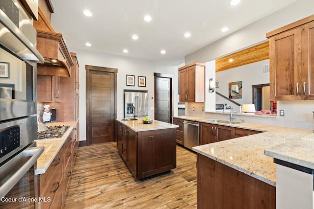 7431 E Cumberland Ct, Hayden, ID 83835 - kitchen featuring recessed lighting, light wood-style floors, a sink, and appliances with stainless steel finishes