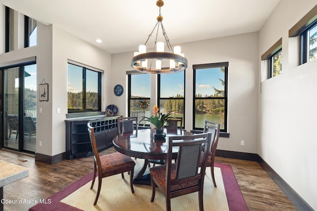 7431 E Cumberland Ct, Hayden, ID 83835 - dining area featuring recessed lighting, dark wood-style flooring, baseboards, and an inviting chandelier