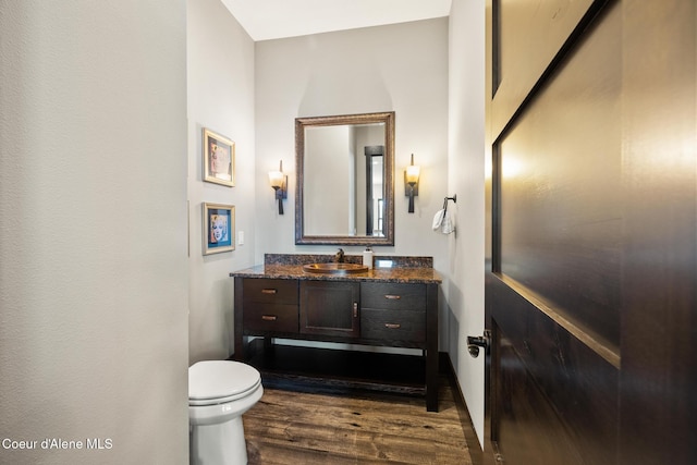 7431 E Cumberland Ct, Hayden, ID 83835 - bathroom with toilet, vanity, and wood finished floors