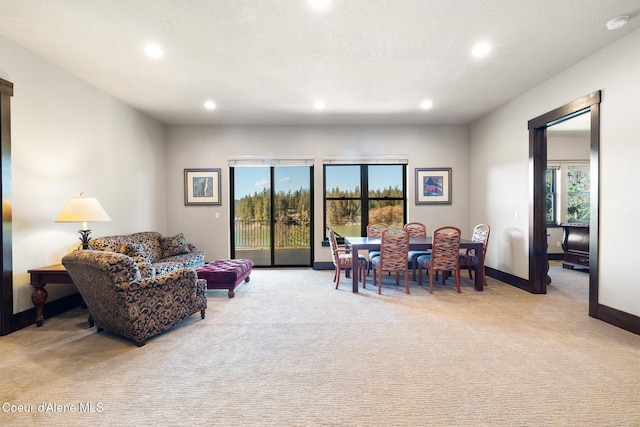 7431 E Cumberland Ct, Hayden, ID 83835 - living room featuring light carpet, recessed lighting, and baseboards