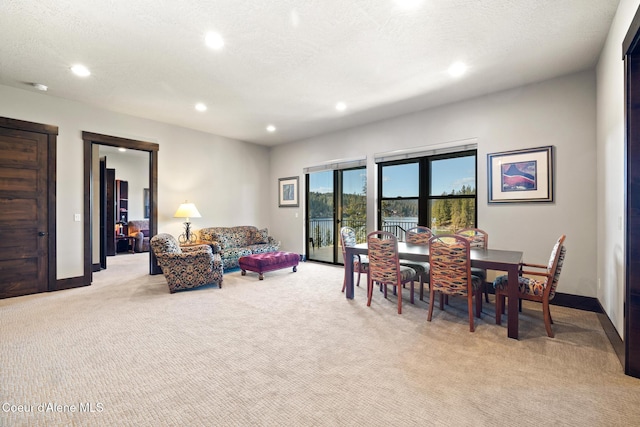 7431 E Cumberland Ct, Hayden, ID 83835 - dining area with light colored carpet, baseboards, and recessed lighting