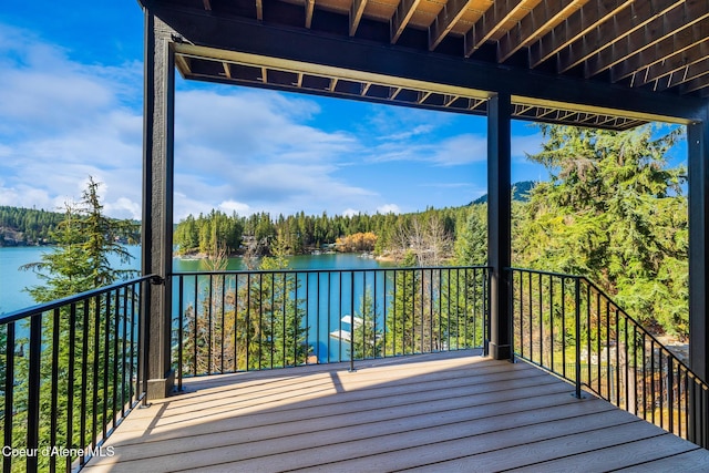 7431 E Cumberland Ct, Hayden, ID 83835 - deck featuring a water view and a forest view