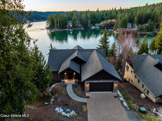 7431 E Cumberland Ct, Hayden, ID 83835 - aerial view at dusk with a view of trees and a water view