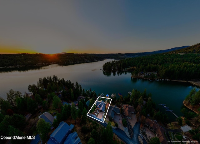 7431 E Cumberland Ct, Hayden, ID 83835 - aerial view at dusk featuring a water view and a wooded view