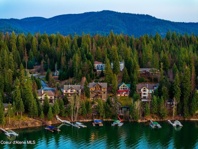 7431 E Cumberland Ct, Hayden, ID 83835 - birds eye view of property with a view of trees and a water and mountain view