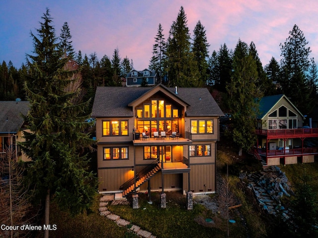 7431 E Cumberland Ct, Hayden, ID 83835 - back of property at dusk featuring stairs