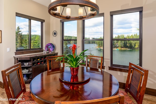 7431 E Cumberland Ct, Hayden, ID 83835 - dining area featuring wood finished floors and a water view