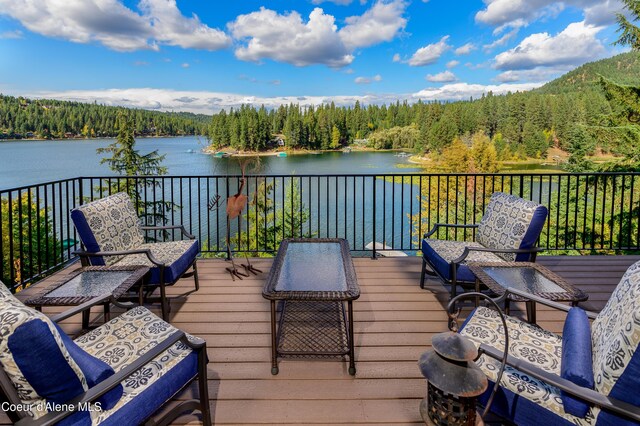 7431 E Cumberland Ct, Hayden, ID 83835 - wooden terrace with a wooded view and a water view