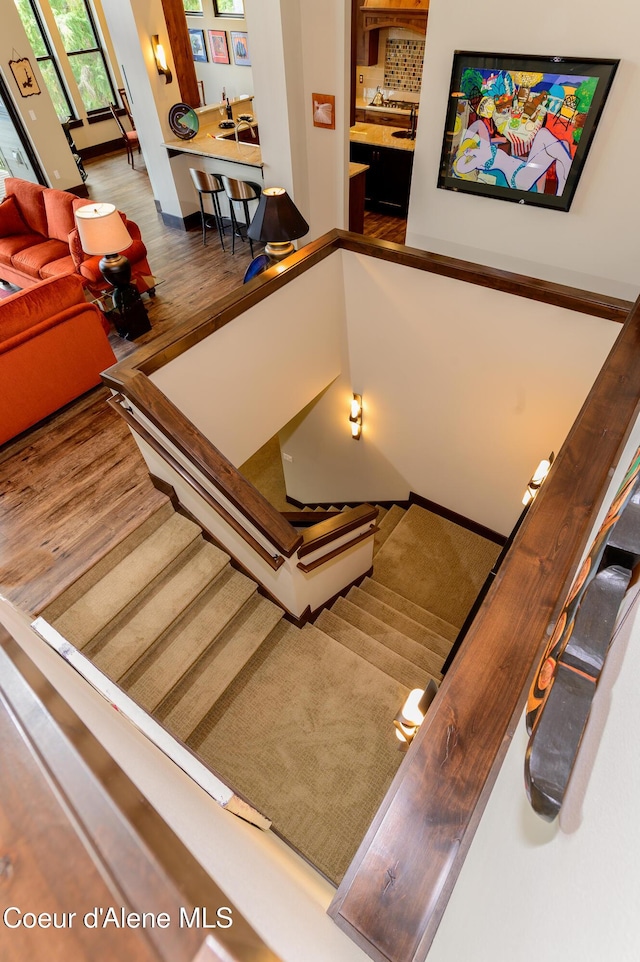 7431 E Cumberland Ct, Hayden, ID 83835 - staircase featuring wood finished floors