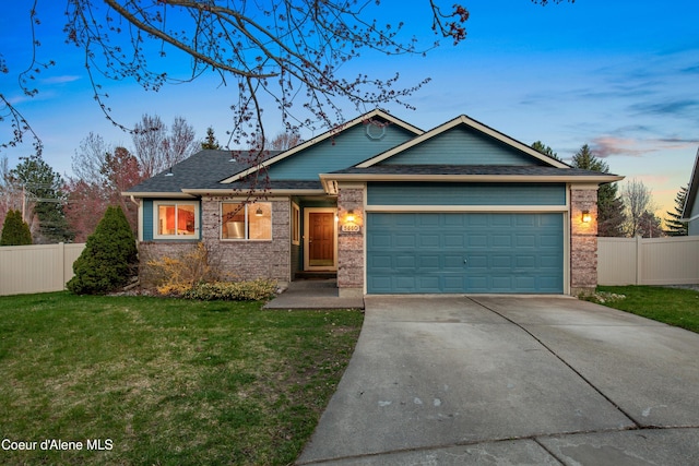 5660 N Loraine St, Coeur Dalene, ID 83815 - view of front of property with an attached garage, driveway, fence, and a lawn