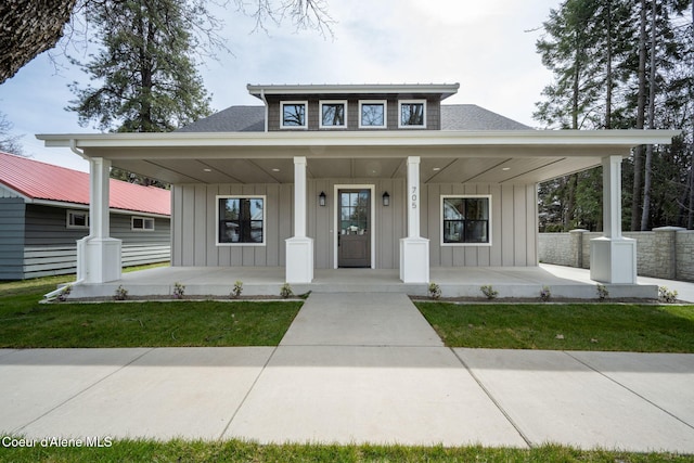 view of front of home featuring a porch, roof with shingles, and board and batten siding