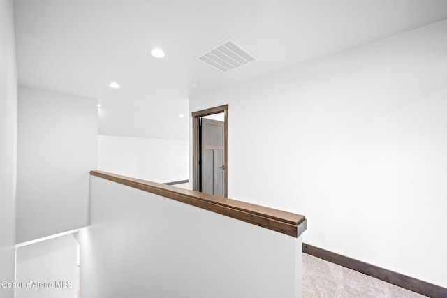 corridor featuring carpet flooring, recessed lighting, an upstairs landing, and visible vents