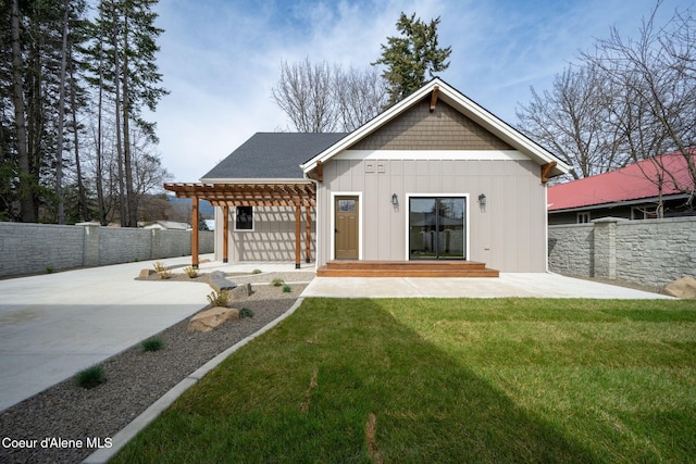 rear view of property with board and batten siding, a fenced backyard, a patio, and a pergola