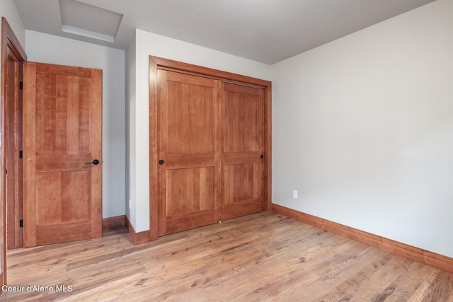 45 Welty Dr, Dover, ID 83825 - unfurnished bedroom featuring light wood-type flooring, a closet, and baseboards