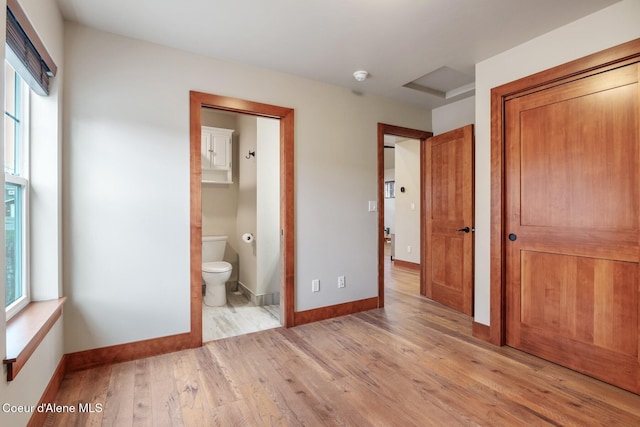 45 Welty Dr, Dover, ID 83825 - unfurnished bedroom featuring light wood-style flooring, a closet, baseboards, and multiple windows