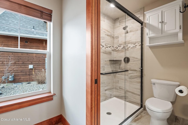 45 Welty Dr, Dover, ID 83825 - full bathroom featuring a shower stall, baseboards, and toilet