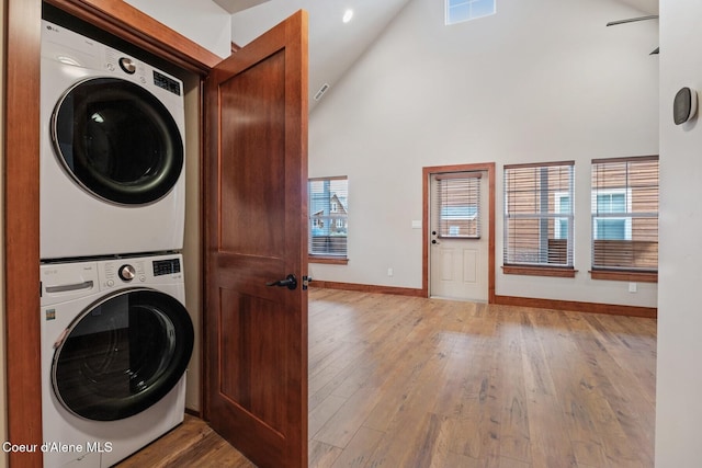 45 Welty Dr, Dover, ID 83825 - laundry area featuring laundry area, visible vents, a high ceiling, stacked washing maching and dryer, and baseboards