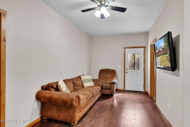 181 E Deer Meadow Ln, Blanchard, ID 83804 - living room with dark wood-style flooring, baseboards, and a ceiling fan