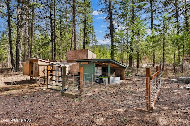 181 E Deer Meadow Ln, Blanchard, ID 83804 - view of side of property featuring a wooded view and an outdoor structure