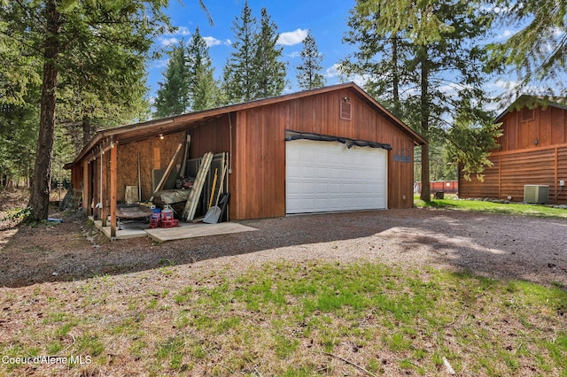 181 E Deer Meadow Ln, Blanchard, ID 83804 - garage with a detached garage and central air condition unit