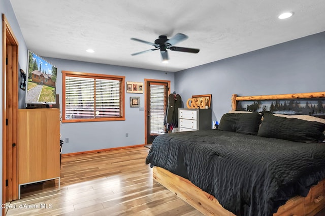 181 E Deer Meadow Ln, Blanchard, ID 83804 - bedroom with wood finished floors, baseboards, a ceiling fan, and recessed lighting