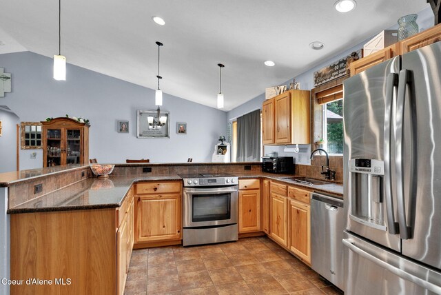 181 E Deer Meadow Ln, Blanchard, ID 83804 - kitchen with a peninsula, a sink, lofted ceiling, and stainless steel appliances