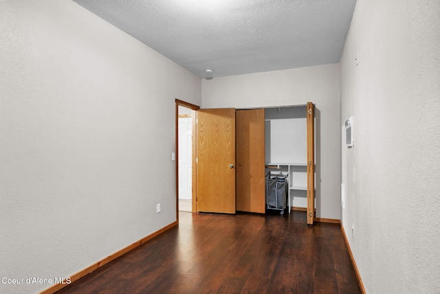 181 E Deer Meadow Ln, Blanchard, ID 83804 - unfurnished bedroom featuring wood finished floors and baseboards