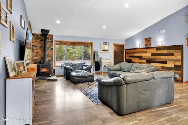 181 E Deer Meadow Ln, Blanchard, ID 83804 - living area featuring recessed lighting, a wood stove, light wood finished floors, and vaulted ceiling
