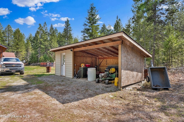 181 E Deer Meadow Ln, Blanchard, ID 83804 - view of outbuilding featuring a detached carport and an outdoor structure