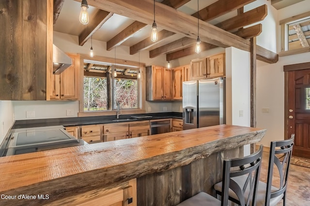 164 Generations Dr, Athol, ID 83801 - kitchen featuring a sink, appliances with stainless steel finishes, a breakfast bar, a peninsula, and butcher block counters