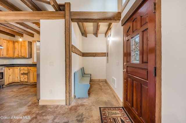 164 Generations Dr, Athol, ID 83801 - entryway featuring visible vents, baseboards, concrete flooring, and beam ceiling