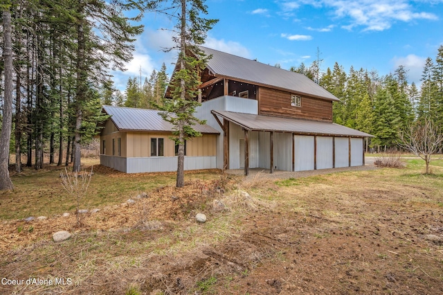 164 Generations Dr, Athol, ID 83801 - rear view of house featuring metal roof and a garage