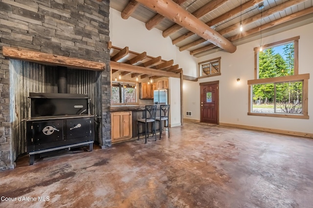 164 Generations Dr, Athol, ID 83801 - living area with concrete floors, a high ceiling, a wealth of natural light, wood ceiling, and beamed ceiling
