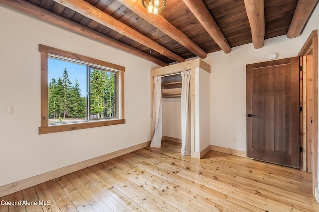 164 Generations Dr, Athol, ID 83801 - unfurnished bedroom with beam ceiling, wood-type flooring, wooden ceiling, and baseboards